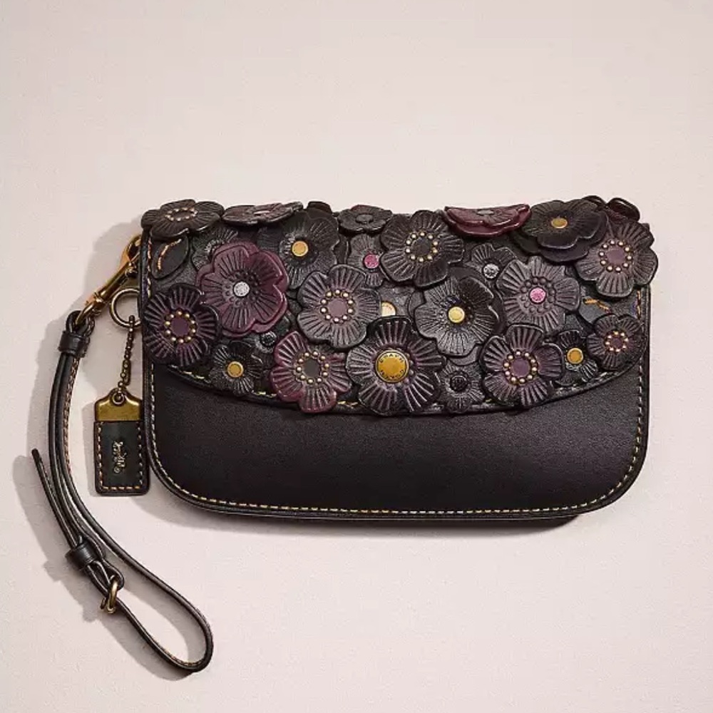 Coach black and oxblood tea rose clutch